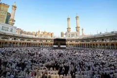 TOPSHOT - Muslims participate in a special morning prayer around the Kaaba, Islam's holiest shrine, at the Grand Mosque complex in Mecca on June 6, 2025, to mark the start of the Eid al-Adha festival, which marks the end of their Hajj pilgrimage. 