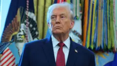US President Donald Trump standing