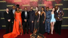(L-R) Jack O'Connell, Omar Benson Miller, Wunmi Mosaku, Ryan Coogler, Michael B. Jordan, Hailee Steinfeld, Jayne Lawson, Miles Caton, Li Jun Li and Delroy Lindo attend di "Sinners" European Premiere for Cineworld Leicester Square on April 14, 2025 in London, England.