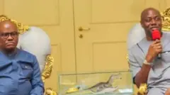 Aworan Minisita fun olu ilu ilẹ wa, Nyesom Wike, o wọ aṣọ alawọ aro, o si lo igo, o n wo ọọkan. Lẹgbẹẹ rẹ ni Gomina ipinle Oyo, Onimọẹrọ Seyi Makinde. Makinde mu ẹrọ gbohungbohun dani, o n sọrọ lọwọ , aṣo alawọ eeru lo wọ, o si n rẹrin-in muse. IlẹKun alawọ ofeefe ni aworan to wa lẹyin wọn.