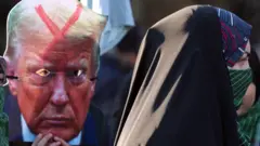 Members of Iran's female paramilitary force (Basij) hold up an image of Donald Trump with a red X across his forehead during a protest in Tehran on 10 January 2025, days before his January 2025 inauguration