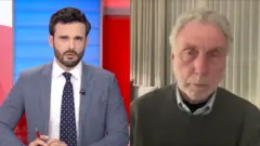 BBCの司会者とバロン氏の写真