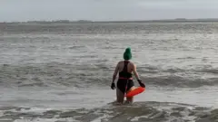 Svitlana walking into the sea