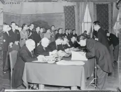 Signing of Peace Agreement Between Japan, Thailand and French Indo-China
Japan brokers a peace treaty between French Indo-China and Thailand. Left to right; French delegates Rene Robin, Ambassador Charles Arsene-Henry; Japanese delegates Ambassador Hajime Matsumiya, Foreign Minister Matsuoka; and Thai delegates Prince Varnvaidyakara Varavarn, Minister Phyasri Sena, Phya Silpa Sastrakom, Chief of General Staff, and Nai Vanich, Chief of the Commerce Bureau.