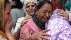 Family and friends show their grief as naval officer Vinay Narwal's body is brought to them
