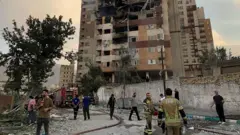 A view of a damaged building in the Iranian capital, Tehran, following an attack, on June 13, 2025
