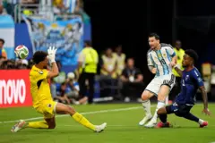 Lionel Messi of Argentina scores di team first goal, Vozinha of Cape Verde, Diney of Cape Verde during di Round Of 32 - FIFA World Cup 2026 match between Argentina and Cabo Verde for di Miami Stadium on July 3, 2026 for Miami Gardens, Florida