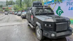 A convoy of police vehicles parked along a street of Muzaffarabad, the capital of Pakistan-administered Kashmir, on June 12, 2026 during a protest called by the Joint Awami Action Committee (JAAC)