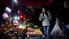 Kyiv resident at night market 