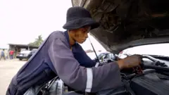 Joy Stephen Justin dey work on motor engine