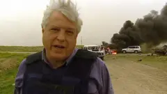 Симпсон на фоне горящих машин