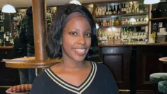 Amanda smiles at the front