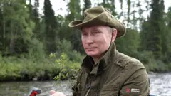Володимир Путін на Єнісеї під час поїздки до Туви, серпень 2018 року