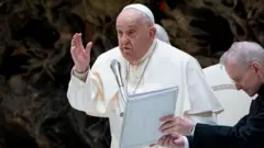  Pope Francis  dey supported by a catholic