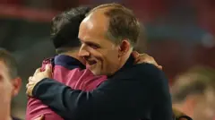 England head coach Thomas Tuchel is embraced by a member of his backroom team after the 5-0 win against Serbia in Belgrade