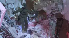 Emergency services at scene of  destroyed buildings