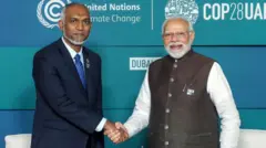 మోదీ, మయిజ్జూ