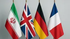 پرچم های ایران و سه کشور اروپایی بریتانیا، فرانسه و آلمان