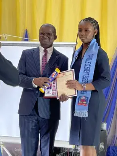 Young lady receiving certificate
