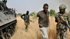 Nigerian sojas capture one terrorist afta one operation against Boko Haram terrorists for one terrorist camp for Borno, Nigeria on March 29, 2016