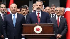 فیدان قبل از آن که وزیر خارجه شود، بیش از یک دهه ریاست سازمان اطلاعاتی ترکیه را به عهده داشت