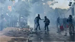 Police fire protesters tear gas