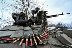 A Ukrainian serviceman checks a machine gun of a tank after loading an ammunition during a military training near a frontline, amid Russia's attack on Ukraine, in Zaporizhzhia Region, Ukraine March 29, 2023