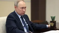 путін