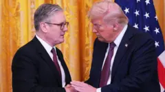 US President Donald Trump and British Prime Minister Keir Starmer shake hands during one joint press conference for di East Room of di White House for Washington, DC, on 27 February, 2025.