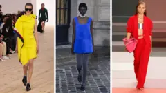 Três modelos em cores primárias — um vestido amarelo (à esquerda), um vestido azul curto e sem mangas (centro) e um conjunto de calça vermelho, usado com um top tomara que caia em cinza e branco por baixo (à direita)