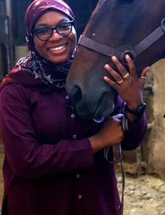 Woman hold horse