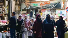 "Kalpten evet" - Suriye'nin hükümet kontrolündeki bölgelerinde her yerde Devlet Başkanı Beşar Esad'ın posterleri var