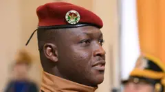Ibrahim Traore wearing red beret looking straight
