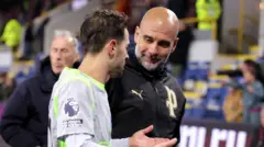 Pep Guardiola smiles at Bernardo Silva