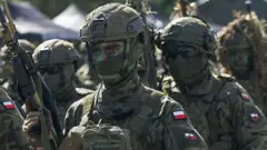 Військові у формі із прихованими обличчями на навчаннях НАТО "Залізний захисник-25"