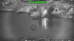 Tangkapan layar dari video yang dirilis militer AS pada 13 Juli, yang menurut mereka menunjukkan serangan terhadap sebuah fasilitas pemeliharaan di Bandar Abbas, Iran.
