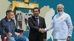 ဇွန်လ ၁ ရက်၊ ဒေလီမြို့ တွေ့ဆုံချိန်မှာ လက်ဆွဲနှုတ်ဆက်နေတဲ့ ဦးမင်းအောင်လှိုင်နဲ့ အိန္ဒိယ ဝန်ကြီးချုပ် နရန်ဒြာမိုဒီ၊ ဦးမင်းအောင်လှိုင်က အနက်ရောင် အနောက်တိုင်းဝတ်စုံ ဝတ်ထား၊ ၀န်ကြီးချုပ်မိုဒီက အိန္ဒိယရိုးရာ အဖြူရောင် အမျိုးသားဝတ်စုံကို ဝတ်ထား၊ နှစ်ယောက်လက်ဆွဲနှုတ်ဆက်ဟန်ပြင်နေတာကိုတွေ့ရ၊ နေ့လယ်ခင်း နေအပူရှိန်ရှိနေတာကိုလည်း အရိပ်ထိုးနေပုံအရ မြင်တွေ့ရ ဓာတ်ပုံ ဘယ်ဘက်အစွန်အမှာတော့ မျက်မှန်ထပ်ထားပြီး နက်ပြာရောင်လက်ရှည်၊ ဂျင်းဘောင်းဘီအပြာရောင်ဝတ်ထားပြီး ပလက်စတစ်ခုံ အနီပေါ် ထိုင်နေတဲ့ သတင်းစာဆရာ ရာဂျိဗ် ကို မြင်တွေ့ရ 