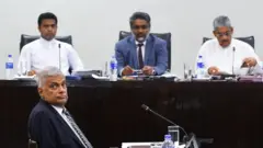 Sri Lanka's Prime Minister Ranil Wickremesinghe (front) testifies before a Special Parliamentary Select Committee (SPSC) investigating the lapses leading to the April 21 Easter Sunday bombings, in Colombo on August 6, 2019