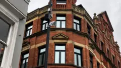 Image shows a speaker on a lamppost, which plays classical music to deter youths in Liverpool