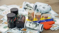 صورة تعبيرية للعملات والنفط