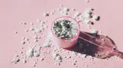 Collagen powder inside measuring spoon