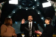 Letitia James, New York's attorney general, from left, Zohran Mamdani, mayor of New York, and his wife Rama Duwaji during a swearing-in ceremony at Old City Hall Station in New York, US, early on Thursday, Jan. 1, 2026. 