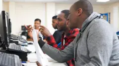 Youths going through computer