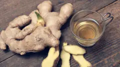 Foto of ginger and tea cup wey sometin dey inside