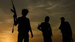 መሳርያ የያዙ ታጣቂዎች