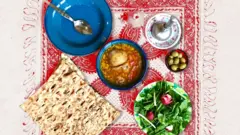 نان سنگک و آبگوشت، سبزی خوردن و زیتون روی یک رومیزی قرمز در کنار گوشت کوب و ظرف خالی و یک قاشق.