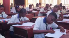 Students writing examination for dia classroom