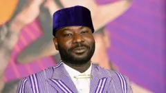 Blitz Bazawule à la première de La couleur pourpre à Los Angeles, États-Unis - 6 décembre 2023