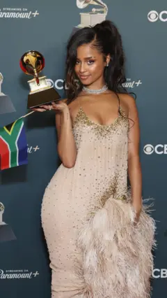 Tyla holding her Grammy Award