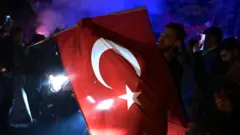 দলীয় পতাকা হাতে এক ভোটার 